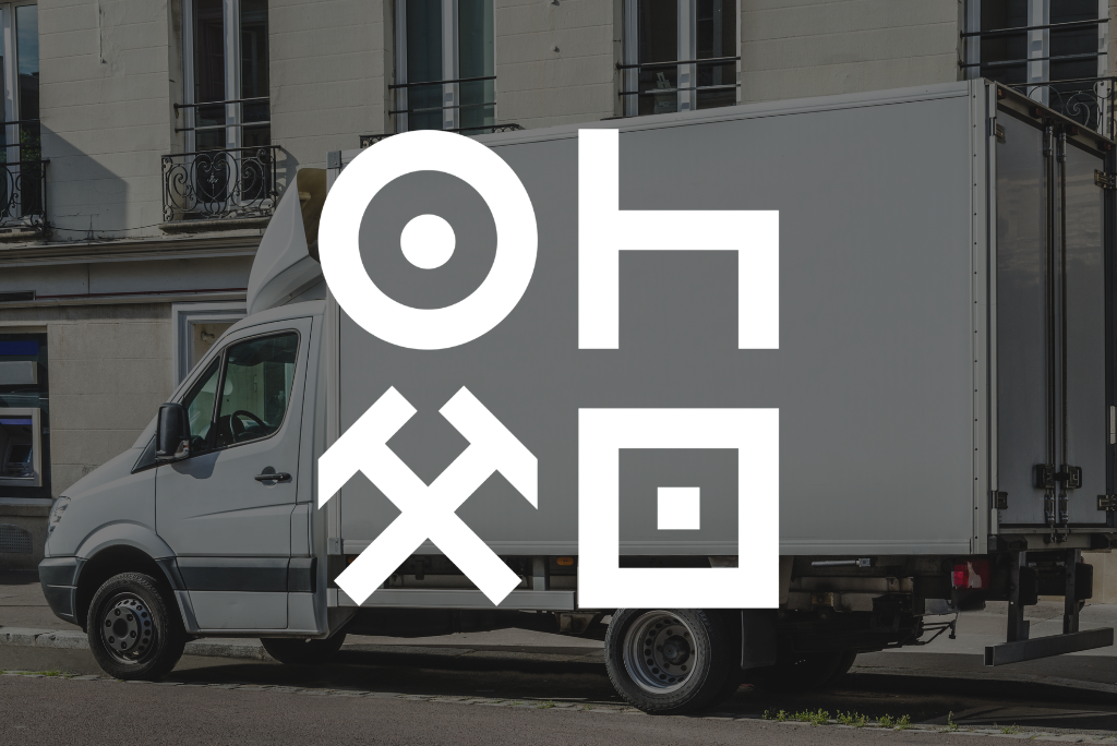 Pictogrammes du tachygraphe sur fond de camionnette de livraison.